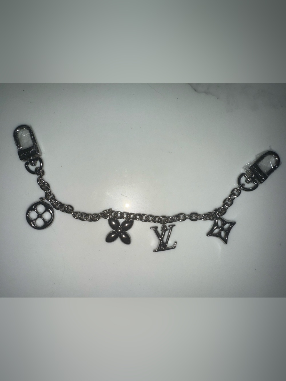 New LV Silver Bag Charm with Iconic LV-Charms